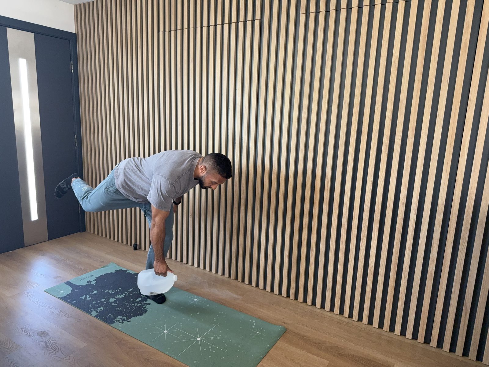 Single-leg Romanian deadlift with a gallon of water